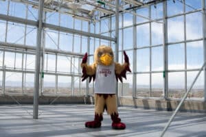 Goldie standing in a building