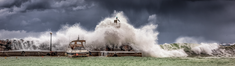 Waves crashing into pier